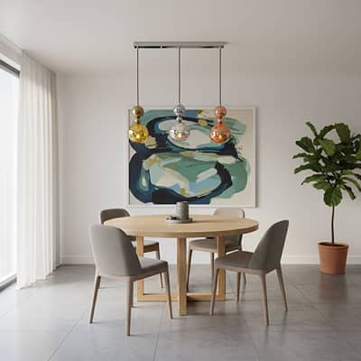 Mixed glass pendant lights creating elegant ambience above the dining table in stylish interiors.
