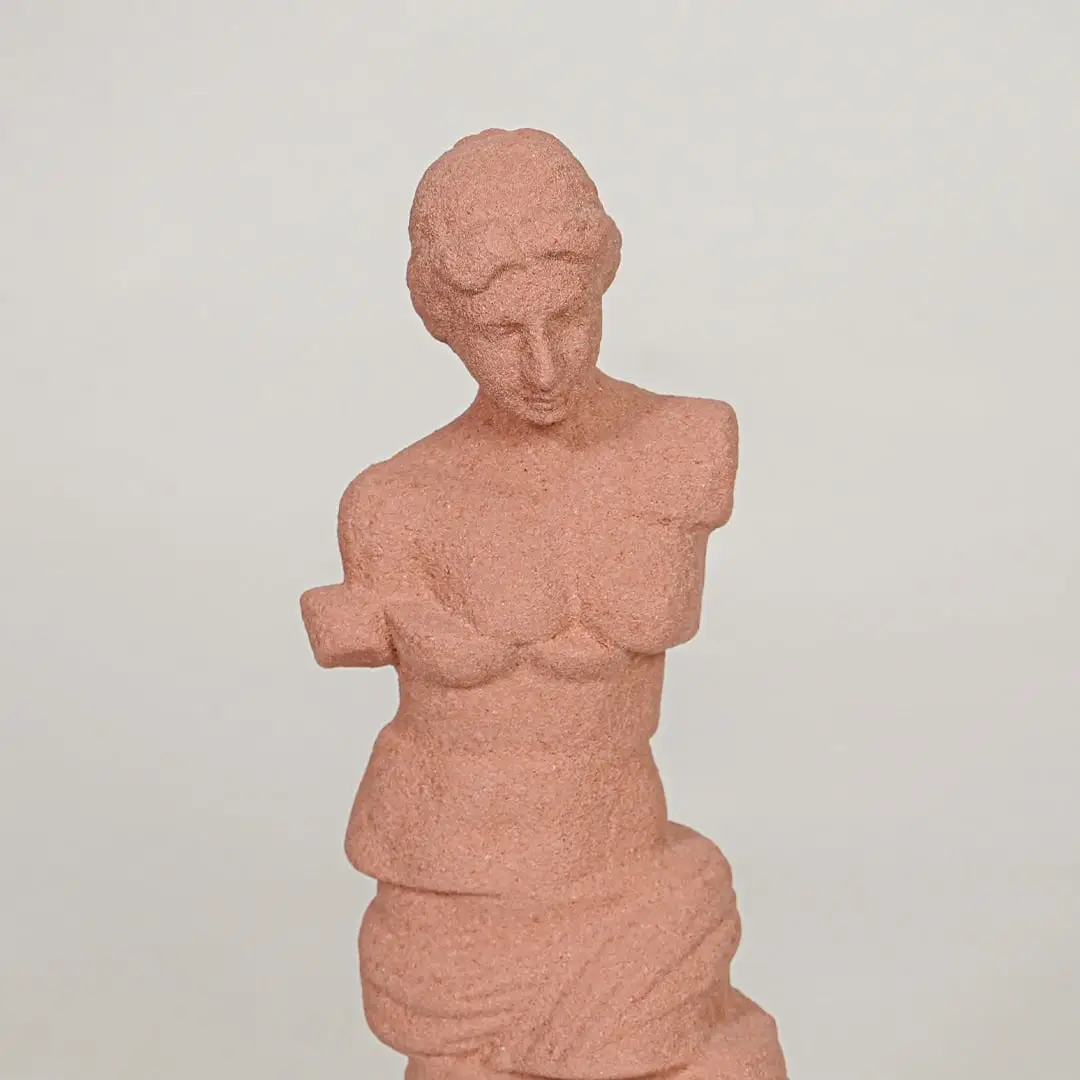 Closeup of terracotta resin lady sculpture with textured finish for artistic tabletop and shelf decor styling.