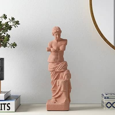 Terracotta resin lady sculpture decor accent placed on console table for elegant modern home decor styling.