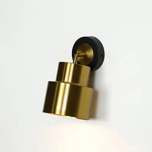 Gold cylindrical wall light with black mount modern wall lamp for bedroom living room stylish decor lighting.