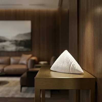 White ceramic decorative showpiece placed on table modern minimal home decor styling idea.