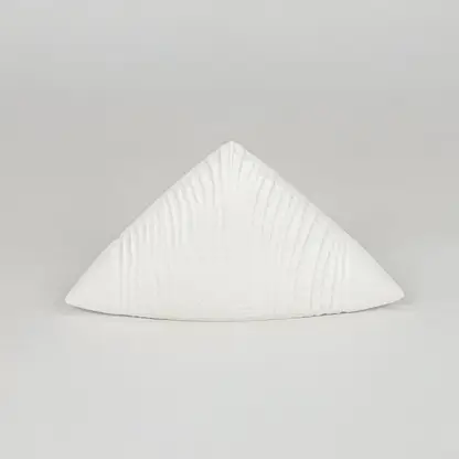 Modern white decorative ceramic showpiece isolated clean background stylish home decor accent piece.