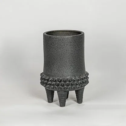 Black ceramic planter vase with textured finish modern decorative pot for tabletop shelf console living room decor styling.